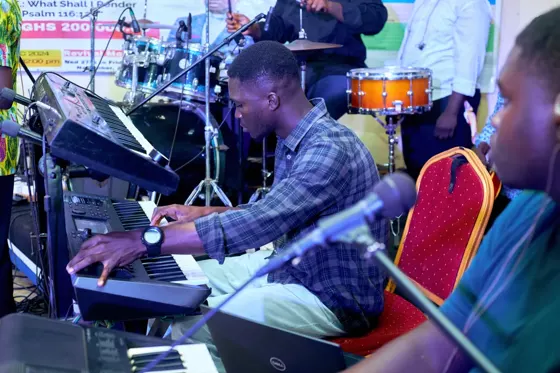 A keyboard musician playing during the gathering